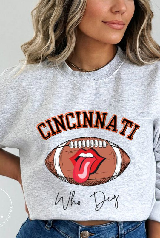 Gear up and show your support for the Cincinnati Bengals with our premium sweatshirt featuring the team's name and rallying slogan, "Who Dey." On a grey sweatshirt. 