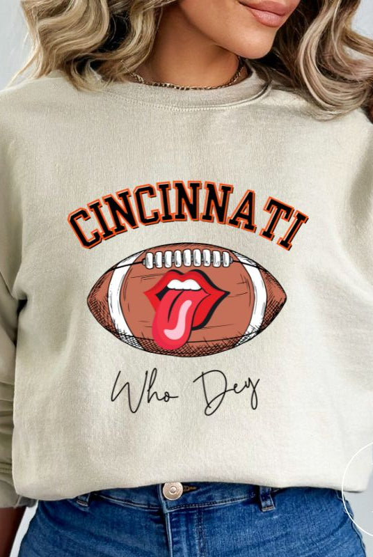 Gear up and show your support for the Cincinnati Bengals with our premium sweatshirt featuring the team's name and rallying slogan, "Who Dey." On a sand colored sweatshirt. 