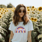 Bella + Canvas 3001 unisex shirt featuring a colorful rainbow design with the word "Clemson" in the center, representing Clemson University on a white graphic tee.