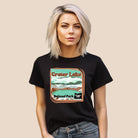 a colorful graphic of Crater Lake National Park, featuring mountains, water, and the text "Crater Lake National Park Oregon 1902 on a black shirt. 