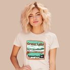 a colorful graphic of Crater Lake National Park, featuring mountains, water, and the text "Crater Lake National Park Oregon 1902 on a white shirt. 