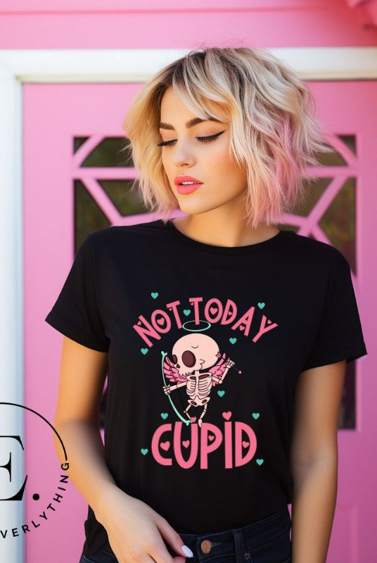 Unleash your rebellious spirit this Valentine's Day with our edgy shirt featuring a skeleton Cupid. The bold "Not Today Cupid" message adds a touch of attitude, making this tee a standout choice for those who march to the beat of their own drum on a black shirt. 