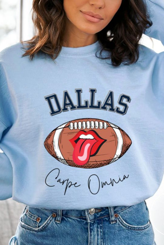 Embrace your Dallas Cowboys pride with our premium sweatshirt showcasing the team's name and empowering slogan, "Crape Omnia." On a blue sweatshirt. 