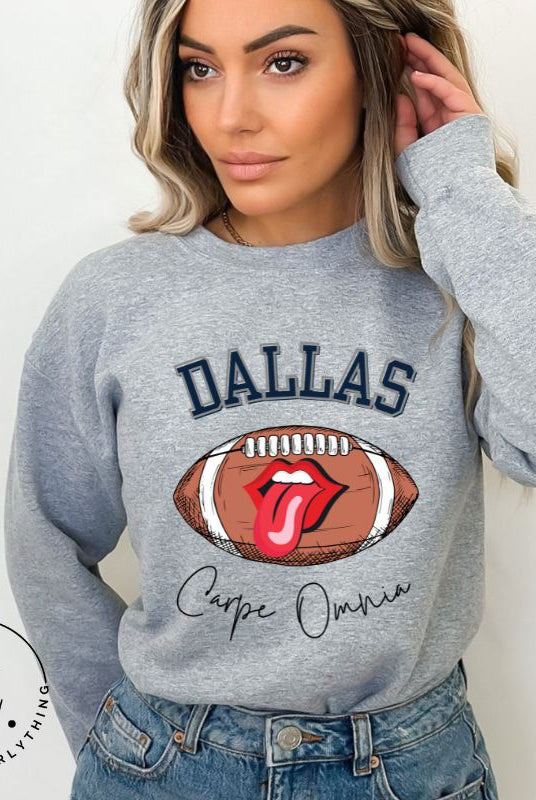 Embrace your Dallas Cowboys pride with our premium sweatshirt showcasing the team's name and empowering slogan, "Crape Omnia." On a grey sweatshirt. 