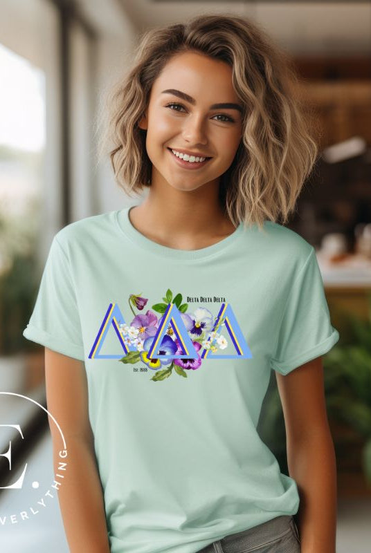 Flaunt your Delta Delta Delta sisterhood with our downloadable PNG sublimation t-shirt design! Featuring the sorority letters and the beautiful pansy on mint shirt. 