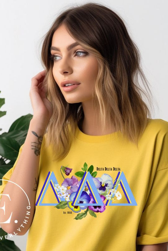 Flaunt your Delta Delta Delta sisterhood with our downloadable PNG sublimation t-shirt design! Featuring the sorority letters and the beautiful pansy on yellow shirt. 