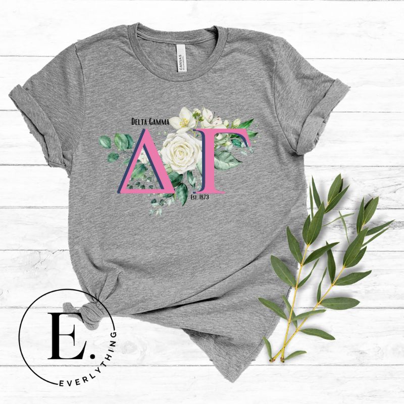 Display your Delta Gamma pride with our downloadable PNG Sublimation t-shirt design! Featuring the sorority letters and the exquisite cream-colored rose on a grey shirt. 