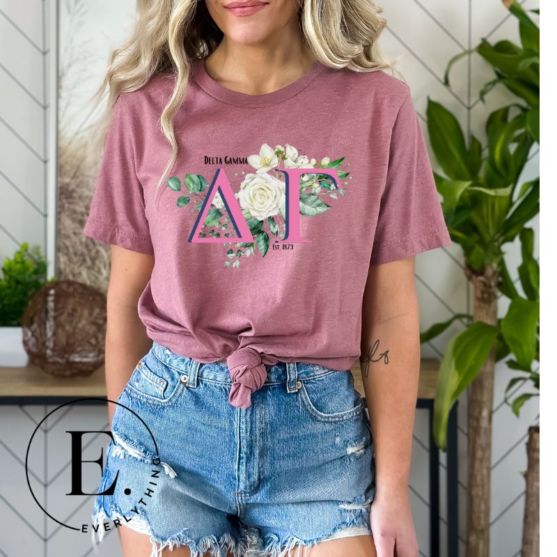 Display your Delta Gamma pride with our downloadable PNG Sublimation t-shirt design! Featuring the sorority letters and the exquisite cream-colored rose on a pink shirt. 