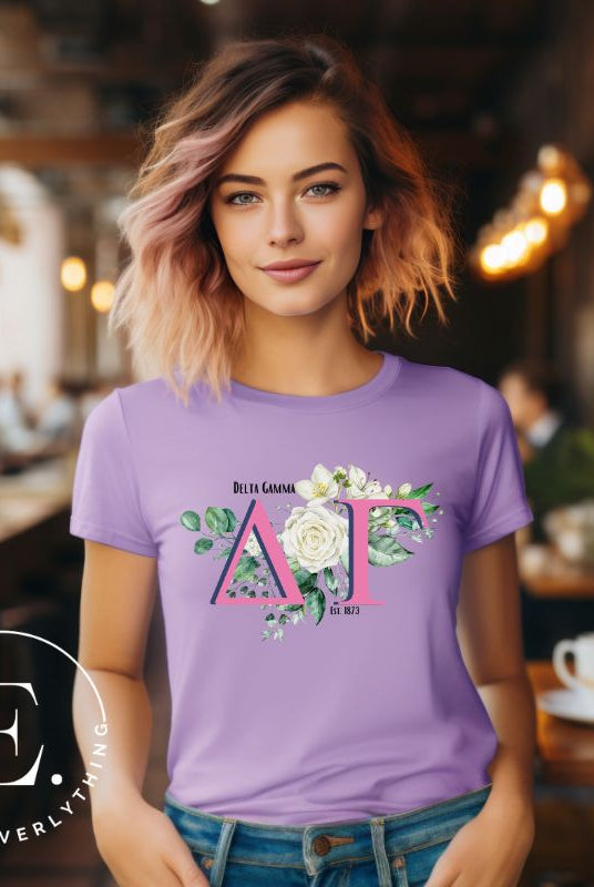 Display your Delta Gamma pride with our downloadable PNG Sublimation t-shirt design! Featuring the sorority letters and the exquisite cream-colored rose on a purple shirt. 
