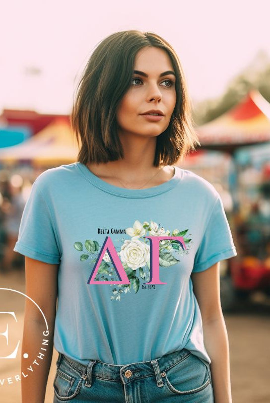 Display your Delta Gamma pride with our downloadable PNG Sublimation t-shirt design! Featuring the sorority letters and the exquisite cream-colored rose on a blue shirt. 