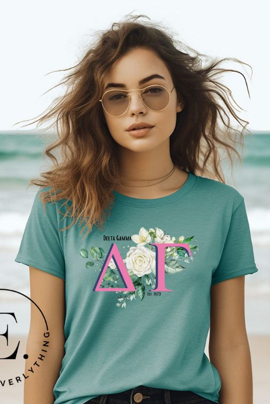 Display your Delta Gamma pride with our sorority t-shirt design! Featuring the sorority letters and the exquisite cream rose on a teal shirt. 