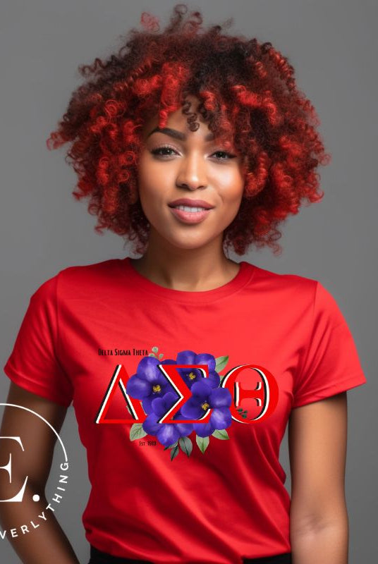 Show off your Delta Sigma Theta sisterhood with our exclusive sorority t-shirt design! The t-shirt features the sorority's letters along with the vibrant African violet, symbolizing empowerment, strength, and courage on a red shirt.