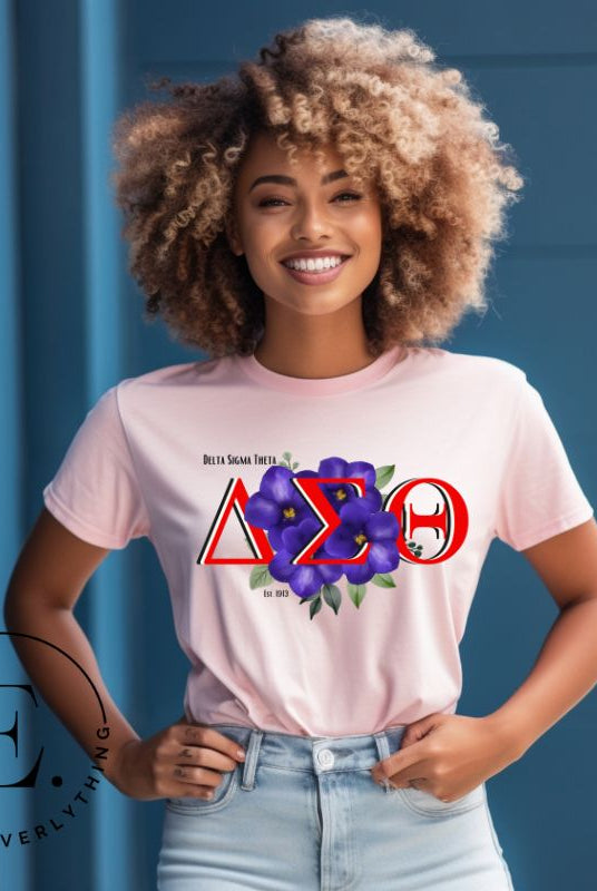Show off your Delta Sigma Theta sisterhood with our exclusive sorority t-shirt design! The t-shirt features the sorority's letters along with the vibrant African violet, symbolizing empowerment, strength, and courage on a pink shirt. 
