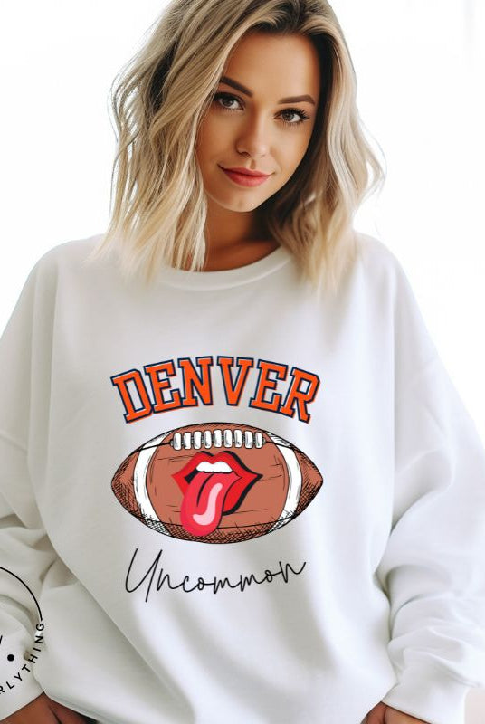 Get ready to show your support for the Denver Broncos in style with our exclusive sweatshirt featuring the team's iconic name and their slogan "uncommon." On a white sweatshirt. 