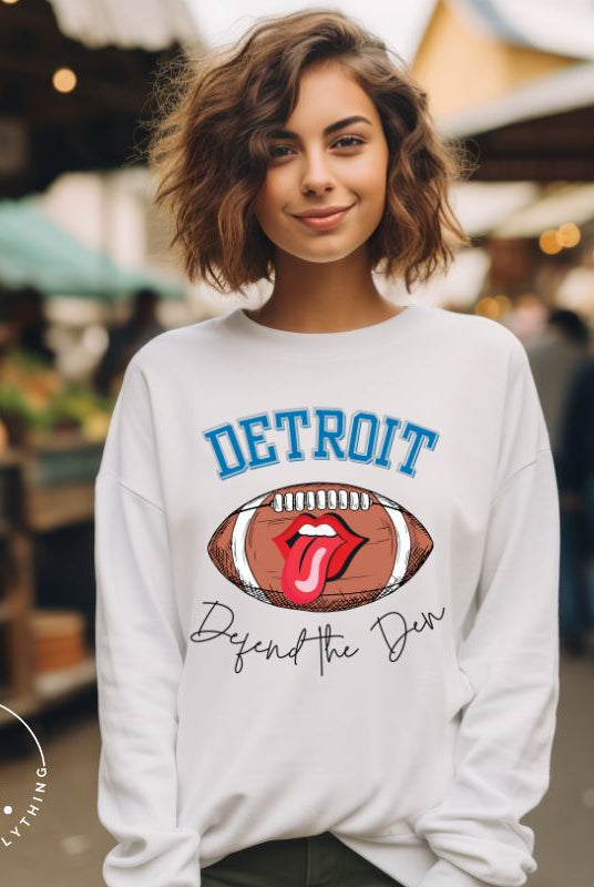 Get ready to show your Detroit Lions pride with this stylish sweatshirt featuring a football and playful lips and tongue design. Complete with the team's slogan "Defend the Den" and the iconic Detroit wordmark, this cozy white sweatshirt. 