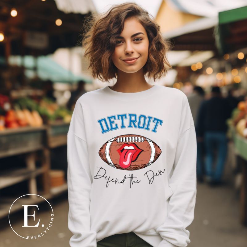 Get ready to show your Detroit Lions pride with this stylish sweatshirt featuring a football and playful lips and tongue design. Complete with the team's slogan "Defend the Den" and the iconic Detroit wordmark, this cozy white sweatshirt. 