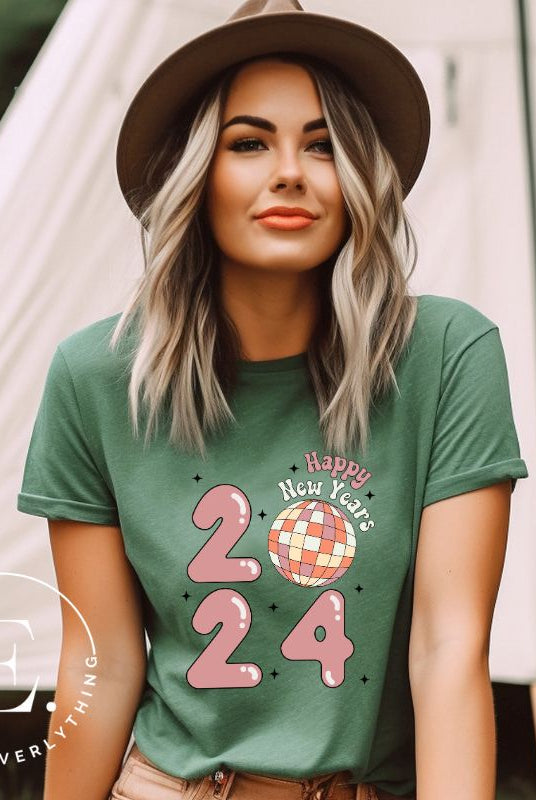 Step into the new year in dazzling style with our 'Happy New Year 2024' shirt. Featuring a shimmering disco ball as the '0' this eye catching design exudes festivity and fun on a green shirt. 