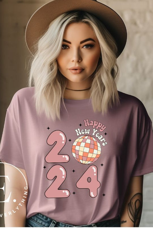 Step into the new year in dazzling style with our 'Happy New Year 2024' shirt. Featuring a shimmering disco ball as the '0' this eye catching design exudes festivity and fun on a purple shirt. 