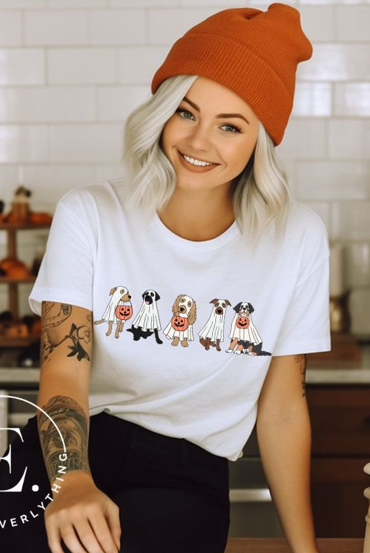 Are you excited for Halloween? Our t-shirt featuring five adorable dogs dressed as ghosts and going trick-or-treating is the perfect way to get into the festive spirit! Whether you're a dog lover or a Halloween enthusiast, on a white shirt. 