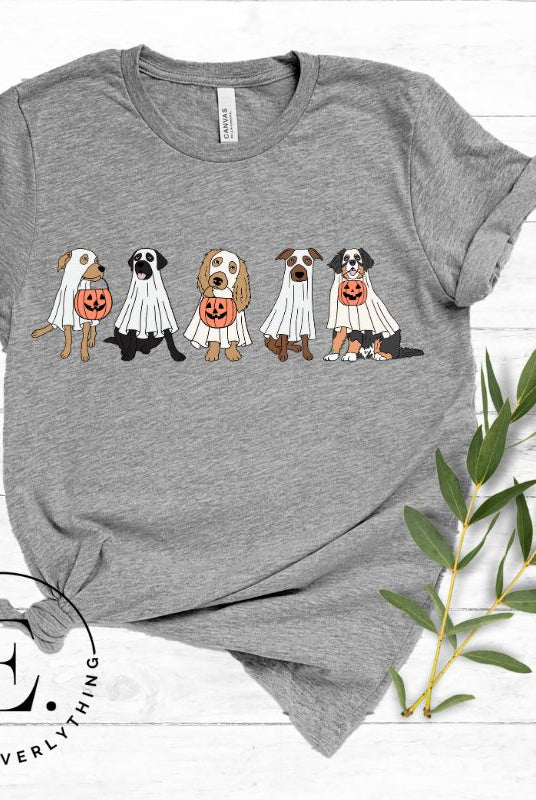Are you excited for Halloween? Our t-shirt featuring five adorable dogs dressed as ghosts and going trick-or-treating is the perfect way to get into the festive spirit! Whether you're a dog lover or a Halloween enthusiast, on a grey shirt. 