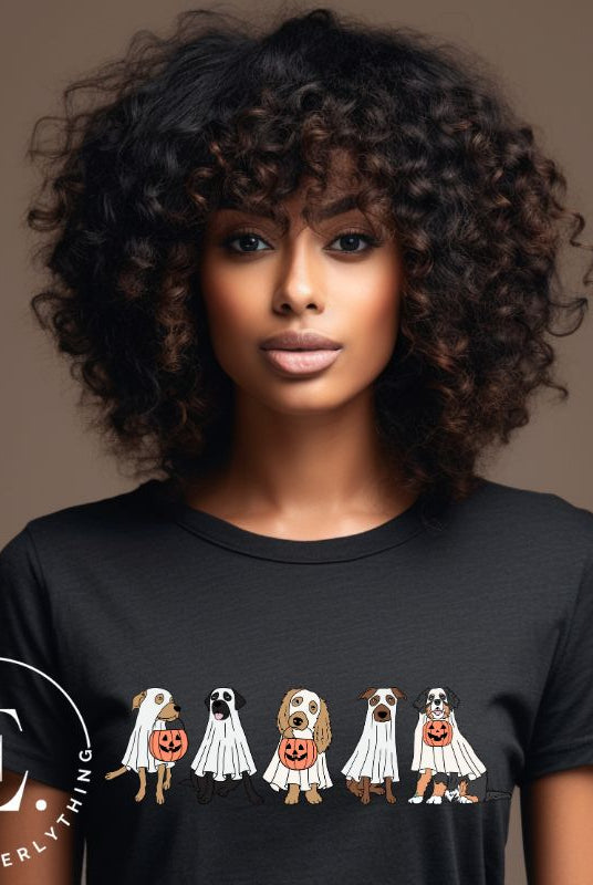 Are you excited for Halloween? Our t-shirt featuring five adorable dogs dressed as ghosts and going trick-or-treating is the perfect way to get into the festive spirit! Whether you're a dog lover or a Halloween enthusiast, on a black shirt. 