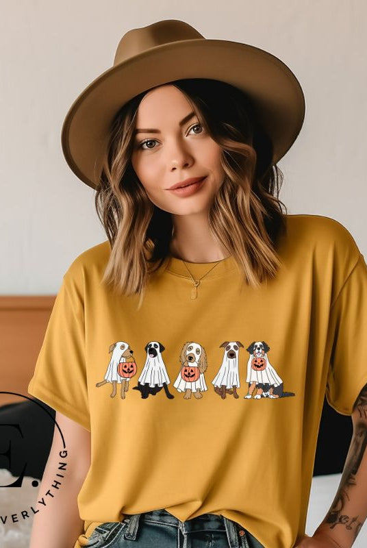 Are you excited for Halloween? Our t-shirt featuring five adorable dogs dressed as ghosts and going trick-or-treating is the perfect way to get into the festive spirit! Whether you're a dog lover or a Halloween enthusiast, on a yellow shirt.