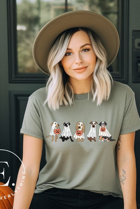 Are you excited for Halloween? Our t-shirt featuring five adorable dogs dressed as ghosts and going trick-or-treating is the perfect way to get into the festive spirit! Whether you're a dog lover or a Halloween enthusiast, on s green shirt. 