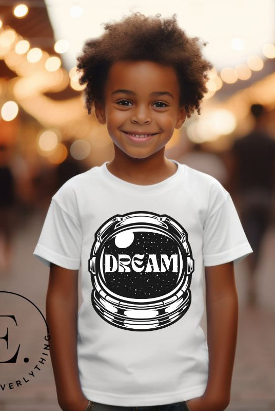 Inspire your little space explorer with our astronaut helmet tee featuring the word 'dream' on the visor on a white shirt. 