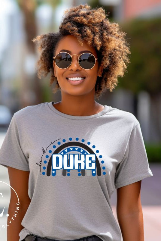 Celebrate diversity and show your support for Duke University with our eye-catching college t-shirt. Our shirt features the Duke colors on a captivating rainbow design, embodying the spirit of inclusion and unity with the iconic Duke wordmark atop the rainbow on a grey shirt. 