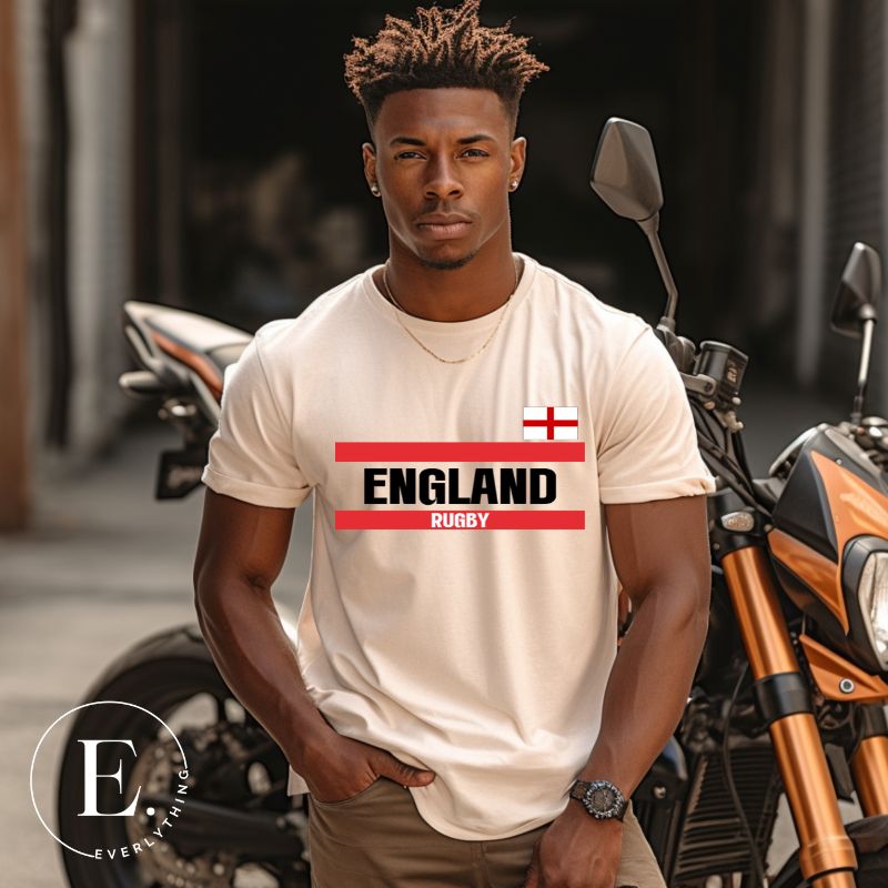 Introducing our England Rugby Graphic T-Shirt - made for rugby fans who want to show off their pride in a stylish and contemporary way! Featuring the words "England Rugby" and the iconic England flag,  on a heather dust colored shirt. 