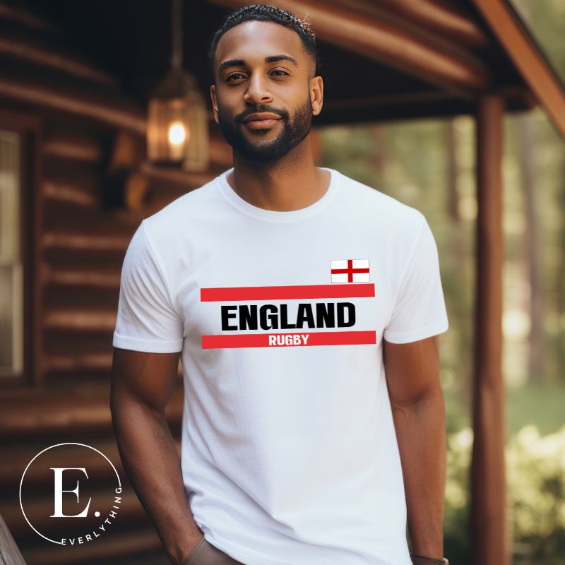Introducing our England Rugby Graphic T-Shirt - made for rugby fans who want to show off their pride in a stylish and contemporary way! Featuring the words "England Rugby" and the iconic England flag,  on a white shirt. 