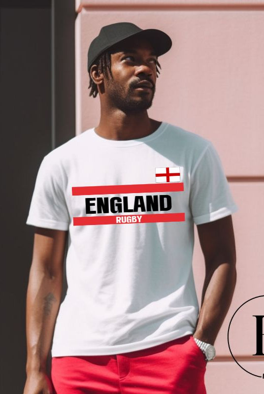 Introducing our England Rugby Graphic T-Shirt - made for rugby fans who want to show off their pride in a stylish and contemporary way! Featuring the words "England Rugby" and the iconic England flag, on a white shirt. 