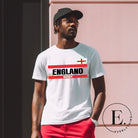 Introducing our England Rugby Graphic T-Shirt - made for rugby fans who want to show off their pride in a stylish and contemporary way! Featuring the words "England Rugby" and the iconic England flag, on a white shirt. 