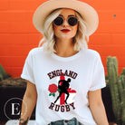 Introducing our England Rugby Graphic T-Shirt - the ultimate fusion of patriotism, rugby pride, and contemporary style! This captivating t-shirt features the words "England Rugby" and the iconic England flag artfully incorporated within the outline of the country, accompanied by a dynamic rugby player graphic on a white shirt. 