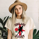 Introducing our England Rugby Graphic T-Shirt - the ultimate fusion of patriotism, rugby pride, and contemporary style! This captivating t-shirt features the words "England Rugby" and the iconic England flag artfully incorporated within the outline of the country, accompanied by a dynamic rugby player graphic on a soft cream shirt. 