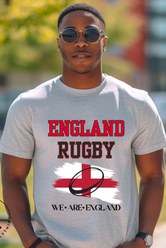 Introducing our England Rugby Graphic T-Shirt - a dynamic and spirited way to showcase your unwavering support for the English rugby team! This captivating t-shirt features the words "England Rugby" and the iconic England flag, with the powerful statement "We are England" proudly displayed beneath the flag on a grey shirt. 
