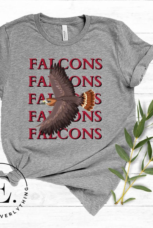 Get ready to soar with style in our Bella Canvas 3001 unisex graphic t-shirt! Featuring a bold Falcon illustration, on a grey shirt. 