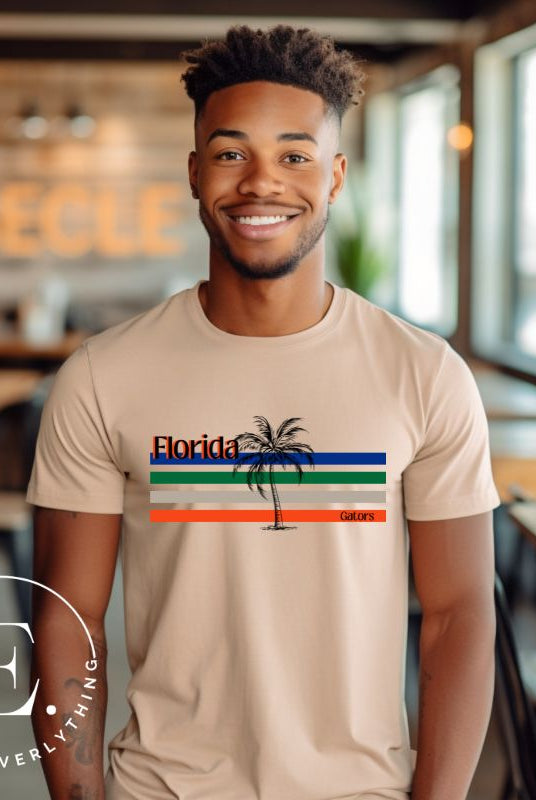 Celebrate your love for the Florida Gators with our modern-inspired retro t-shirt. It captures the essence of campus life, featuring school colors in lines and a palm tree motif on a tan shirt. 