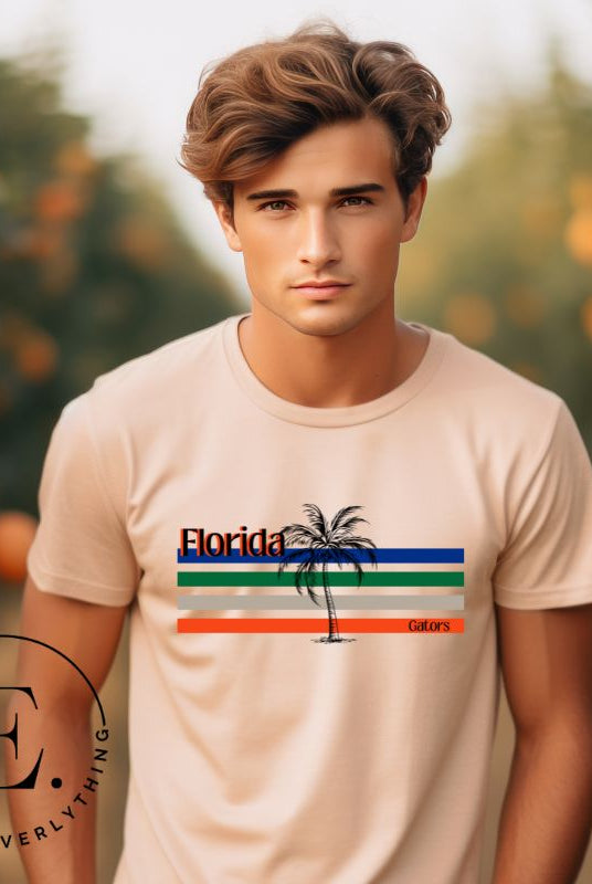 Celebrate your love for the Florida Gators with our modern-inspired retro t-shirt. It captures the essence of campus life, featuring school colors in lines and a palm tree motif on a peach shirt. 