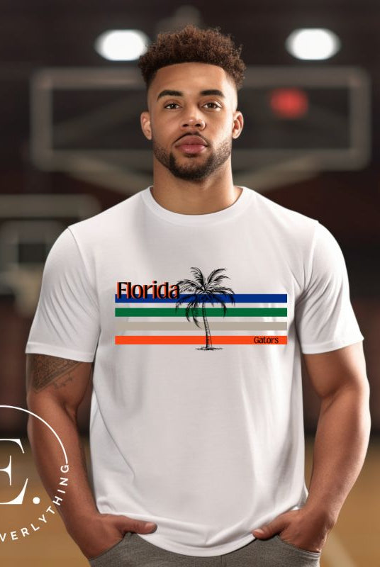 Celebrate your love for the Florida Gators with our modern-inspired retro t-shirt. It captures the essence of campus life, featuring school colors in lines and a palm tree motif on a white shirt. 