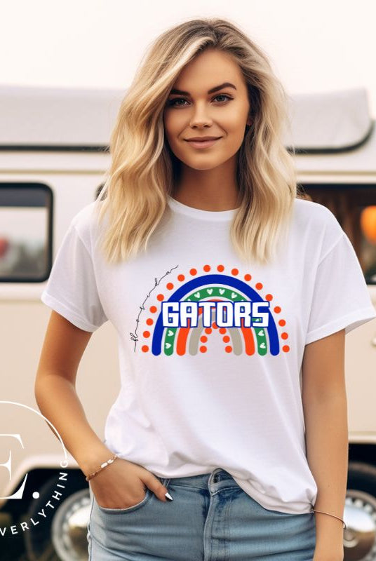 Show off your UF spirit in style with this boho-inspired t-shirt from the University of Florida. The UF colors stands out on this vibrant rainbow background, displaying the school's mascot name in a trendy and unique way on a white shirt. 
