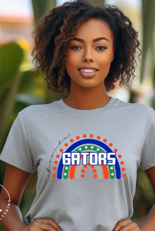 Show off your UF spirit in style with this boho-inspired t-shirt from the University of Florida. The UF colors stands out on this vibrant rainbow background, displaying the school's mascot name in a trendy and unique way on a grey shirt. 