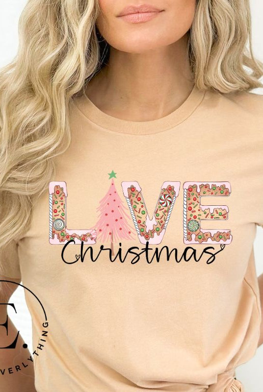 Get ready to celebrate the holiday season in style with our Christmas shirt featuring cute gingerbread cookies arranged to spell out the word "Love" on a soft cream colored shirt.