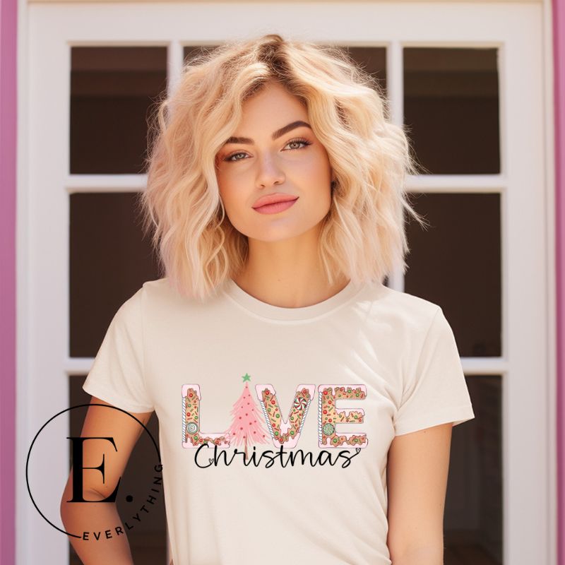 Add a touch of whimsy to your holiday wardrobe with our downloadable Christmas PNG sublimation t-shirt design! The word 'love' is spelled out in adorable gingerbread letters, evoking the warmth and sweetness of Christmas season on a soft cream shirt. 