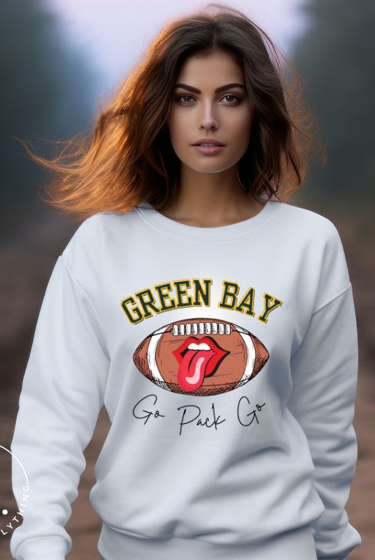 Support the Green Bay Packers in style with our exclusive sweatshirt featuring the team's name and iconic slogan, "Go Pack Go." On a white sweatshirt. 