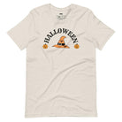 beige t-shirt with a simple Halloween design featuring a witch hat and pumpkins, perfect for spooky season celebrations.