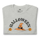 Grey t-shirt with a simple Halloween design featuring a witch hat and pumpkins, perfect for spooky season celebrations.