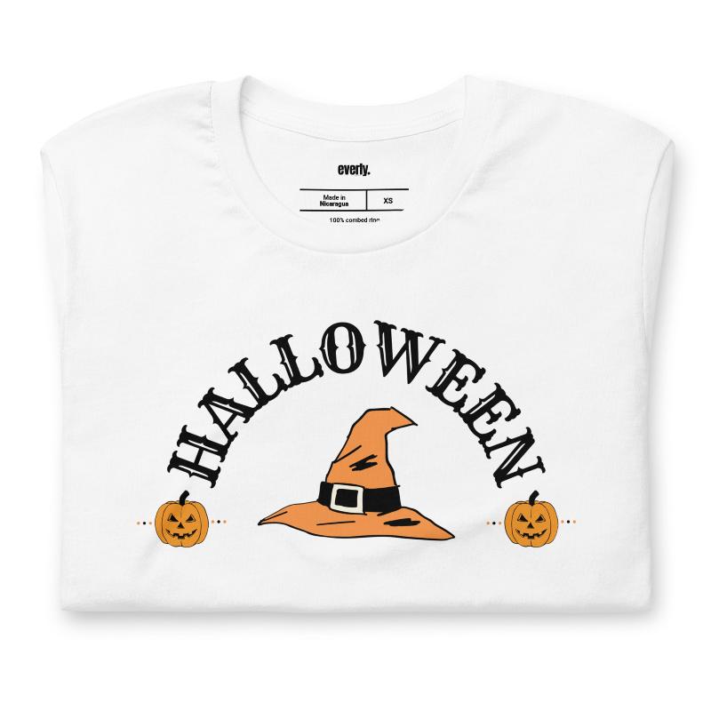 White t-shirt with a simple Halloween design featuring a witch hat and pumpkins, perfect for spooky season celebrations.