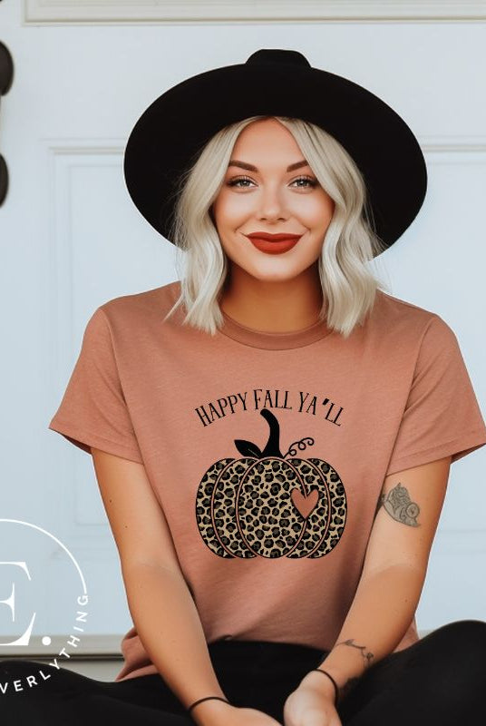 Get ready for fall with our adorable cheetah pumpkin shirt. Featuring a charming design of a cheetah pumpkin with a heart, it's the perfect blend of style and seasonal spirit. Spread the autumn cheer with the saying 'Happy Fall Ya'll' and embrace the coziness of the season on mauve shirt. 