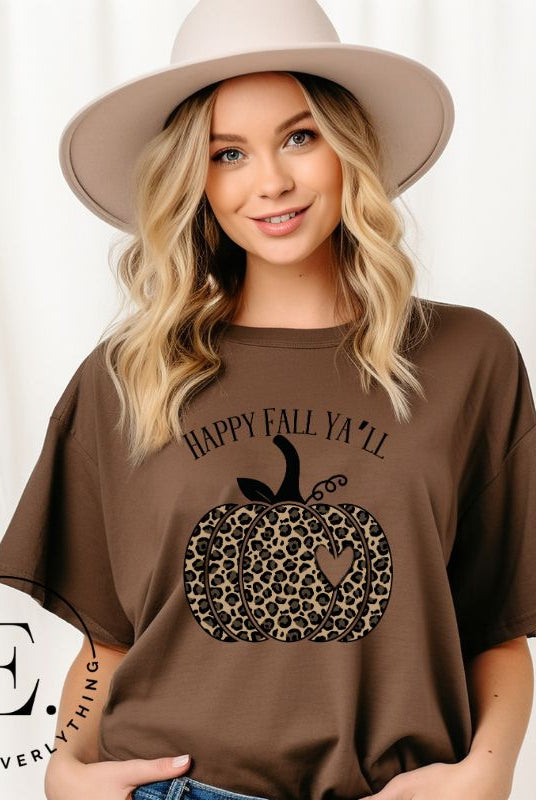 Get ready for fall with our adorable cheetah pumpkin shirt. Featuring a charming design of a cheetah pumpkin with a heart, it's the perfect blend of style and seasonal spirit. Spread the autumn cheer with the saying 'Happy Fall Ya'll' and embrace the coziness of the season on a brown shirt. 